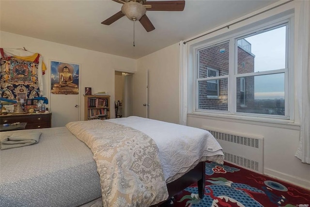 84-50 169th St Unit 606, Jamaica Hills, NY 11432 - bedroom featuring radiator heating unit and a ceiling fan