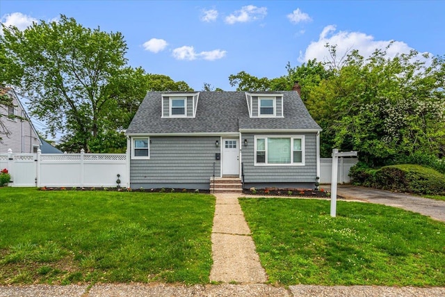 855 Winter Ave, Uniondale, NY 11553 - view of front facade with entry steps, a shingled roof, and a chimney
