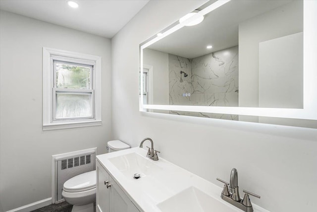 855 Winter Ave, Uniondale, NY 11553 - full bath featuring radiator, toilet, a marble finish shower, double vanity, and recessed lighting