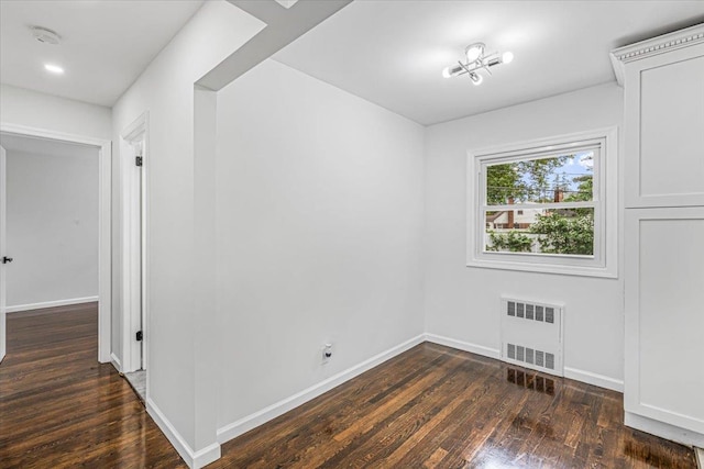 855 Winter Ave, Uniondale, NY 11553 - empty room featuring radiator heating unit, hardwood / wood-style floors, baseboards, and a smoke detector
