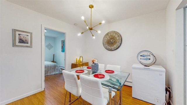 37-40 61st St, Woodside, NY 11377 - dining area with a chandelier, light wood-type flooring, and a baseboard radiator