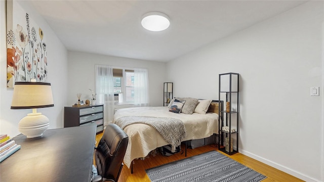 37-40 61st St, Woodside, NY 11377 - bedroom featuring wood finished floors and baseboards