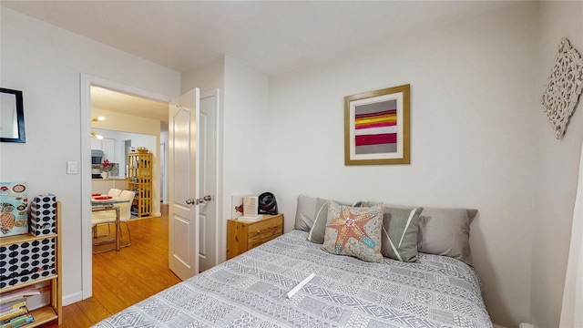 37-40 61st St, Woodside, NY 11377 - bedroom featuring wood finished floors