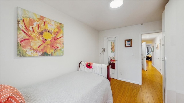 37-40 61st St, Woodside, NY 11377 - bedroom with light wood-style flooring and baseboards