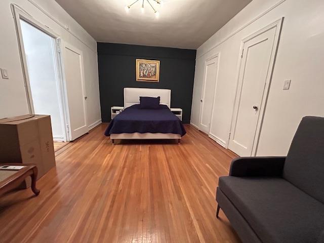 86-10 34th Ave Unit 624, Jackson Heights, NY 11372 - bedroom featuring light wood-type flooring