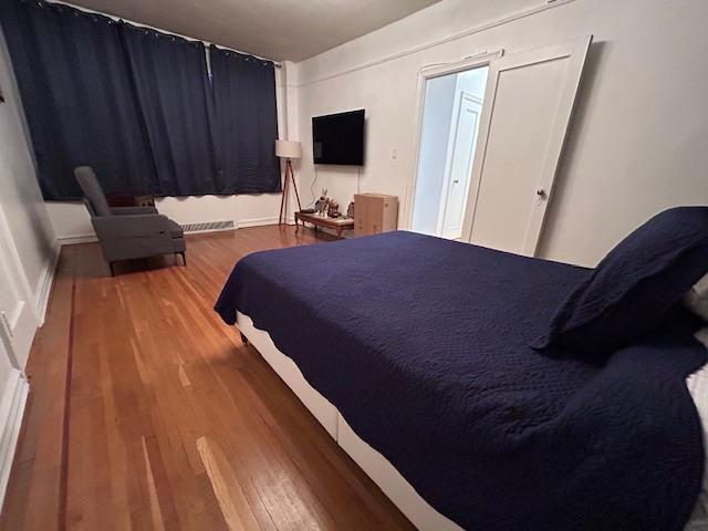 86-10 34th Ave Unit 624, Jackson Heights, NY 11372 - bedroom featuring wood finished floors