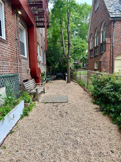 86-10 34th Ave Unit 624, Jackson Heights, NY 11372 - view of yard with a pergola