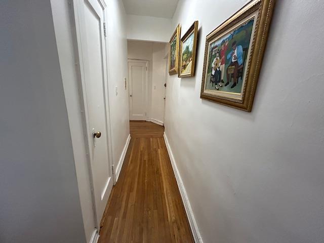 86-10 34th Ave Unit 624, Jackson Heights, NY 11372 - hall with wood finished floors and baseboards