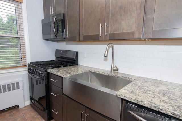 251-10 71st Rd Unit 30A, Bellerose, NY 11426 - kitchen with gas stove, radiator, dishwasher, a sink, and tasteful backsplash