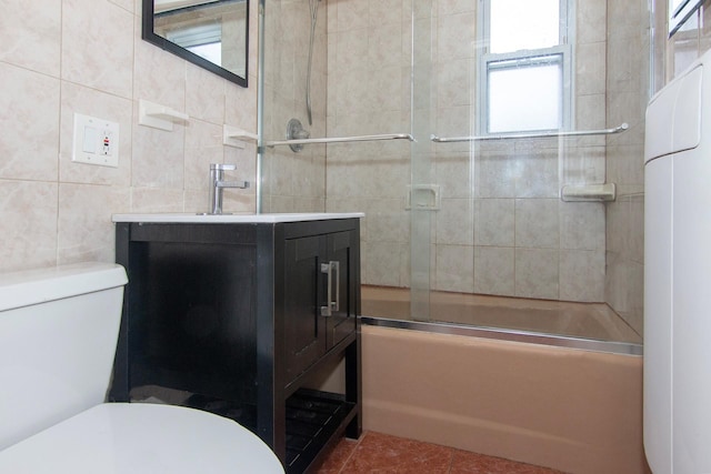 251-10 71st Rd Unit 30A, Bellerose, NY 11426 - full bathroom with toilet, vanity, tile walls, enclosed tub / shower combo, and tile patterned floors