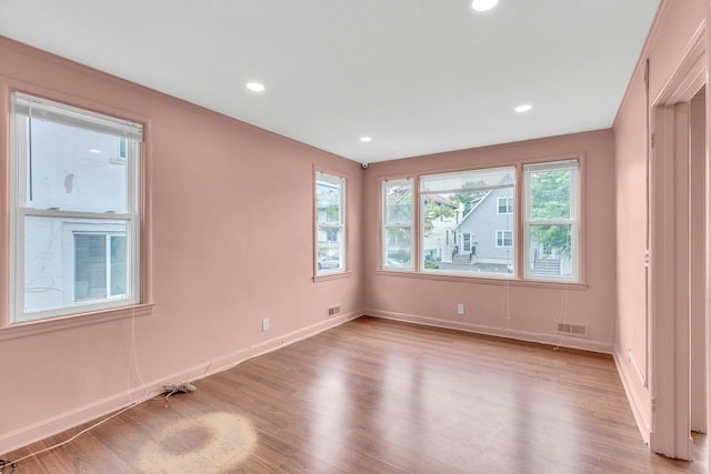 5 E Walnut St, Long Beach, NY 11561 - empty room featuring light wood-style floors, baseboards, and recessed lighting