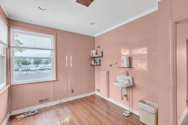 5 E Walnut St, Long Beach, NY 11561 - washroom with crown molding, light wood-style flooring, and baseboards