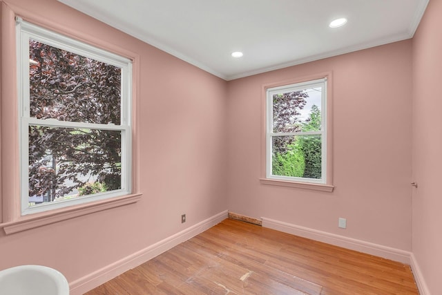 5 E Walnut St, Long Beach, NY 11561 - empty room with baseboards, light wood-type flooring, crown molding, and recessed lighting