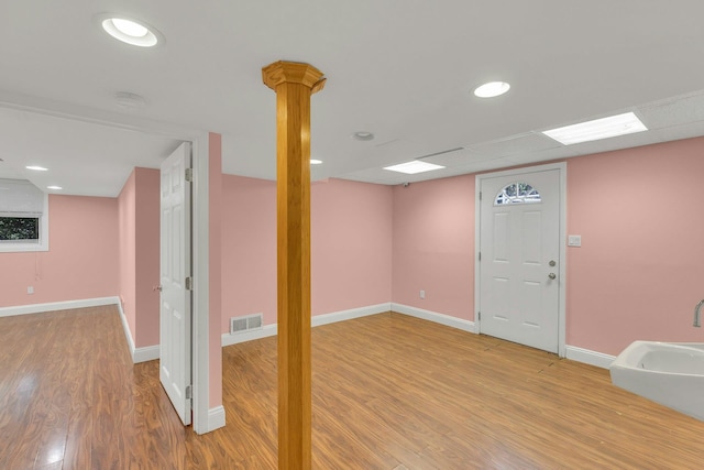 5 E Walnut St, Long Beach, NY 11561 - finished below grade area with light wood-style floors, baseboards, and recessed lighting