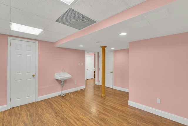 5 E Walnut St, Long Beach, NY 11561 - finished basement with wood finished floors, baseboards, and a drop ceiling