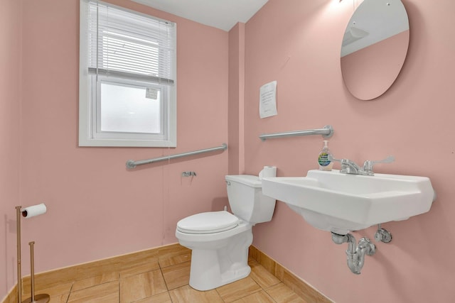 5 E Walnut St, Long Beach, NY 11561 - half bath featuring toilet, baseboards, and tile patterned flooring