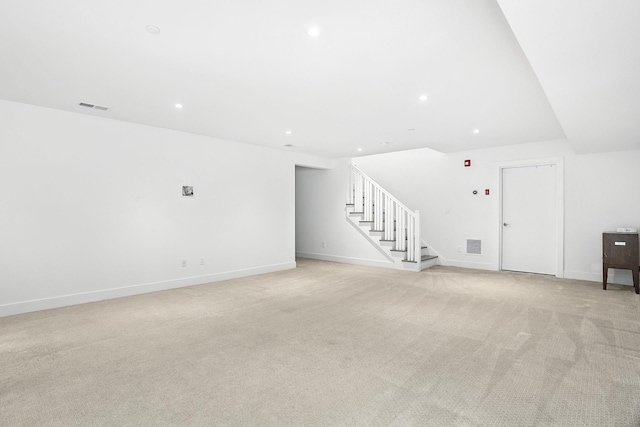 27 Lavender Ln, Rye Brook, NY 10573 - unfurnished living room with stairs, light carpet, and recessed lighting
