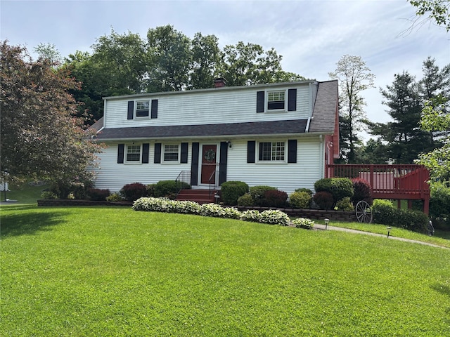 6 Windmill Rd, Poughkeepsie, NY 12601 - view of front facade featuring a front yard, a chimney, a shingled roof, and a deck