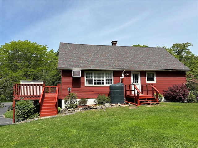 6 Windmill Rd, Poughkeepsie, NY 12601 - view of front facade featuring a front yard, a wooden deck, roof with shingles, and a chimney