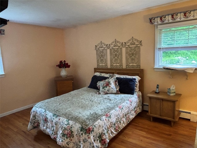 6 Windmill Rd, Poughkeepsie, NY 12601 - bedroom featuring wood finished floors, baseboards, and a baseboard heating unit