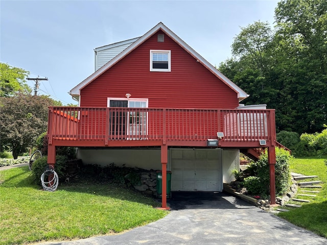 6 Windmill Rd, Poughkeepsie, NY 12601 - view of front of home featuring a garage, a front lawn, a wooden deck, and asphalt driveway