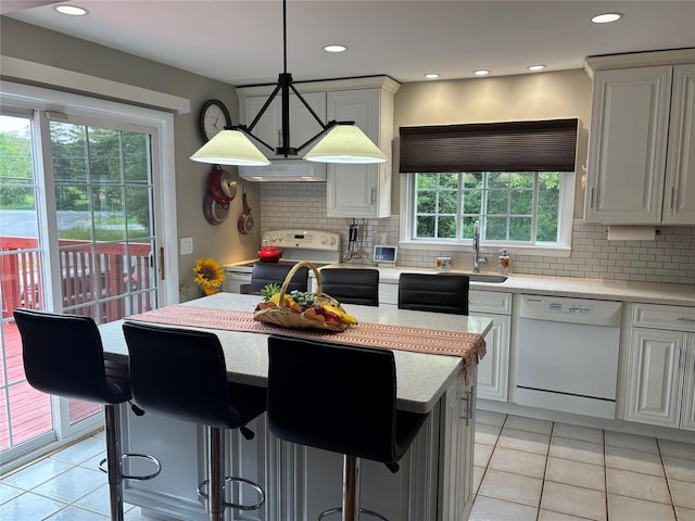 6 Windmill Rd, Poughkeepsie, NY 12601 - kitchen with white appliances, light tile patterned floors, light countertops, range hood, and recessed lighting