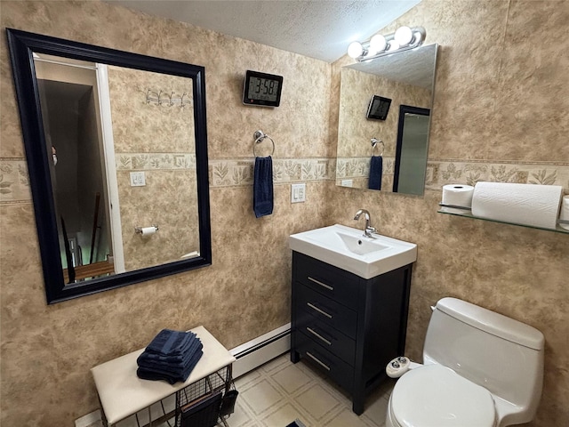6 Windmill Rd, Poughkeepsie, NY 12601 - bathroom with a baseboard heating unit, vanity, toilet, tile patterned floors, and a textured ceiling