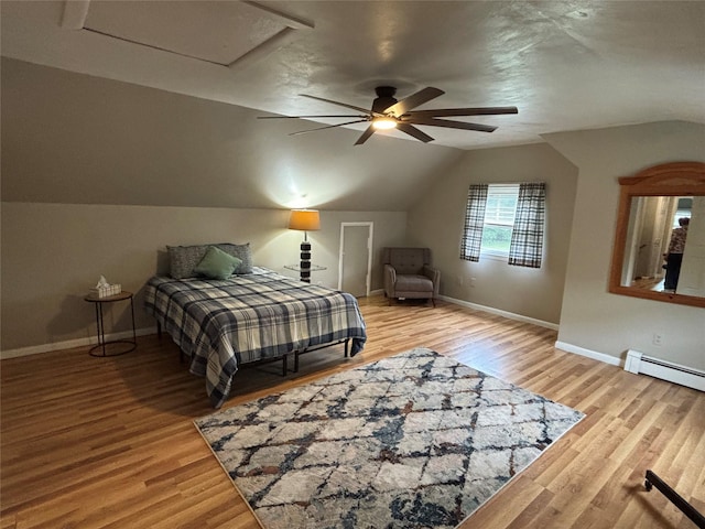 6 Windmill Rd, Poughkeepsie, NY 12601 - bedroom with baseboard heating, baseboards, lofted ceiling, wood finished floors, and a ceiling fan