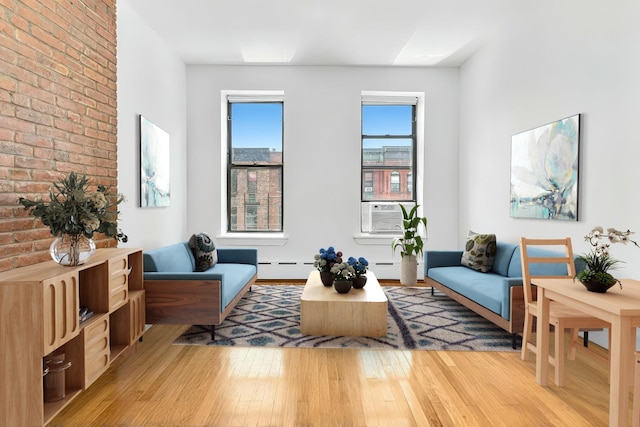 161 W 133rd St, New York Manhattan, NY 10030 - living area with light wood-type flooring, cooling unit, and brick wall