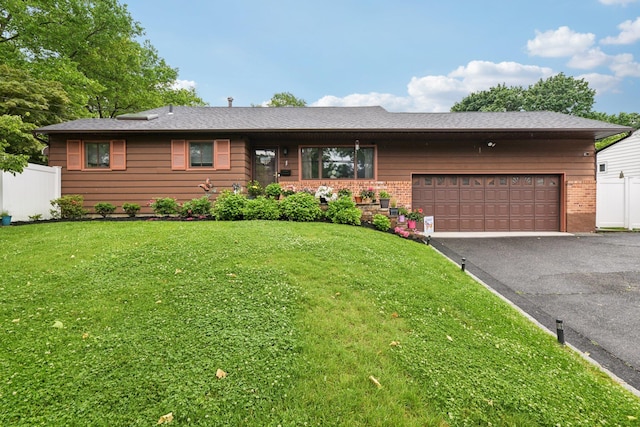 422 Old Bridge Rd, Northport, NY 11768 - ranch-style house with driveway, an attached garage, and brick siding
