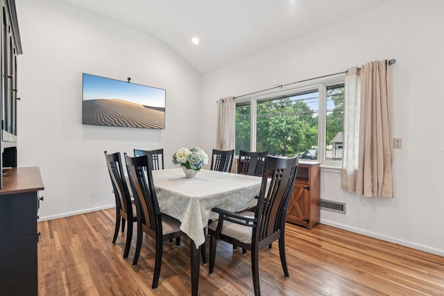 422 Old Bridge Rd, Northport, NY 11768 - dining room with light wood-type flooring, vaulted ceiling, baseboards, and recessed lighting