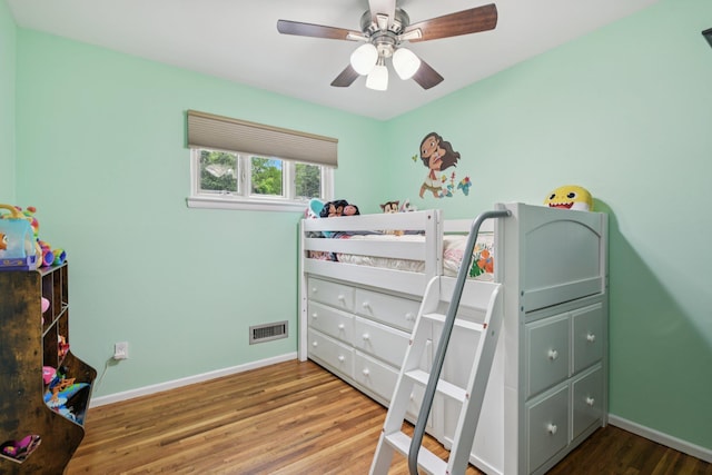 422 Old Bridge Rd, Northport, NY 11768 - bedroom featuring wood finished floors, baseboards, and ceiling fan