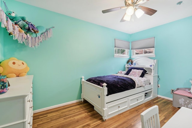 422 Old Bridge Rd, Northport, NY 11768 - bedroom featuring light wood-style floors, a ceiling fan, and baseboards