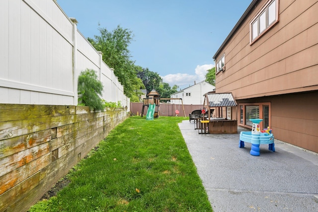 422 Old Bridge Rd, Northport, NY 11768 - view of yard featuring a patio area and a playground