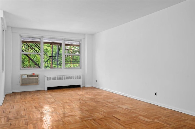 1299 Palmer Ave Unit 218, Larchmont, NY 10538 - spare room featuring radiator, a wall mounted AC, and baseboards