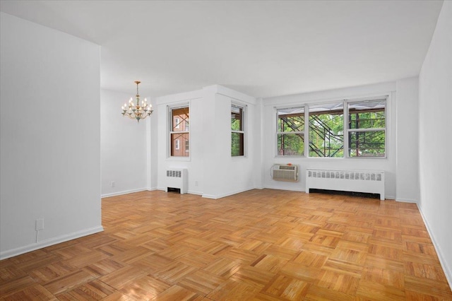 1299 Palmer Ave Unit 218, Larchmont, NY 10538 - unfurnished living room with radiator heating unit, a chandelier, baseboards, and a wall mounted AC