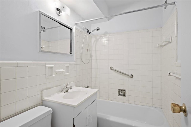 1299 Palmer Ave Unit 218, Larchmont, NY 10538 - bathroom with toilet, vanity, washtub / shower combination, and tile walls