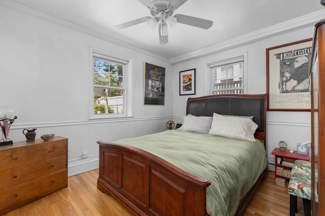 37 Centre St, Bronx, NY 10464 - bedroom with ornamental molding, light wood-style floors, a wainscoted wall, and a ceiling fan