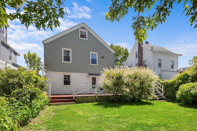 37 Centre St, Bronx, NY 10464 - back of property with a deck and a lawn