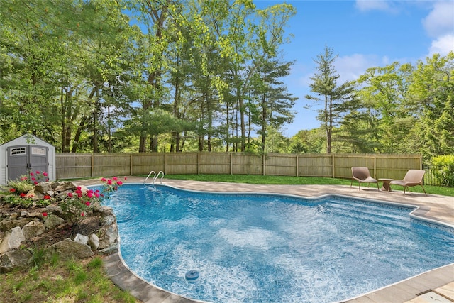 79 Oakside Rd, Smithtown, NY 11787 - view of swimming pool featuring a shed, a fenced backyard, a patio, and view of wooded area