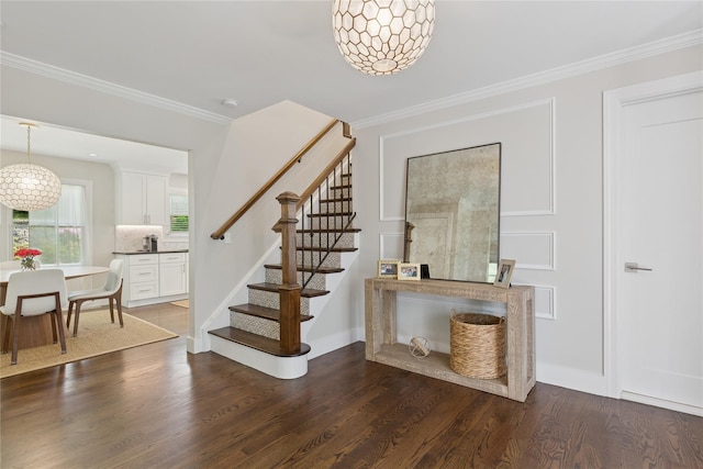 79 Oakside Rd, Smithtown, NY 11787 - foyer entrance with stairs, dark wood-style floors, and ornamental molding