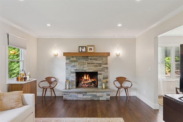 79 Oakside Rd, Smithtown, NY 11787 - living area featuring wood finished floors, a stone fireplace, crown molding, and recessed lighting