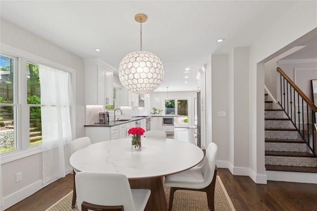 79 Oakside Rd, Smithtown, NY 11787 - dining space with dark wood finished floors, stairs, and recessed lighting