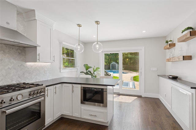 79 Oakside Rd, Smithtown, NY 11787 - kitchen with stainless steel range, wall chimney range hood, open shelves, built in microwave, and a peninsula
