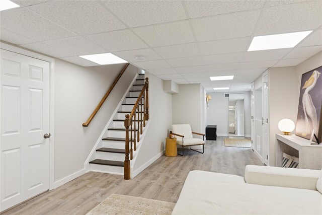 79 Oakside Rd, Smithtown, NY 11787 - interior space featuring wood finished floors, stairway, and a paneled ceiling