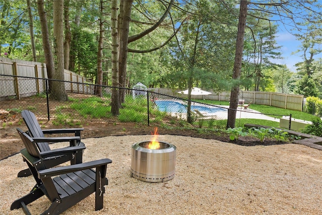 79 Oakside Rd, Smithtown, NY 11787 - fenced backyard with an outdoor fire pit