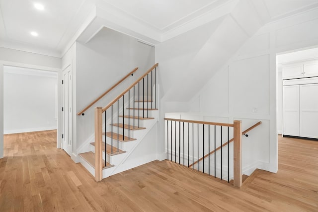 2 Lavender Ln, Rye, NY 10580 - stairs featuring wood finished floors, a decorative wall, recessed lighting, and crown molding