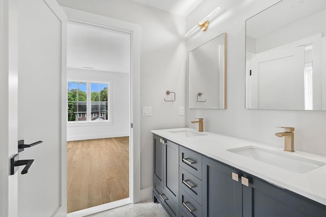 2 Lavender Ln, Rye, NY 10580 - bathroom featuring double vanity and baseboards