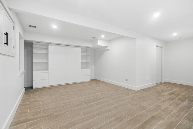 2 Lavender Ln, Rye, NY 10580 - finished basement featuring baseboards, light wood-type flooring, and recessed lighting