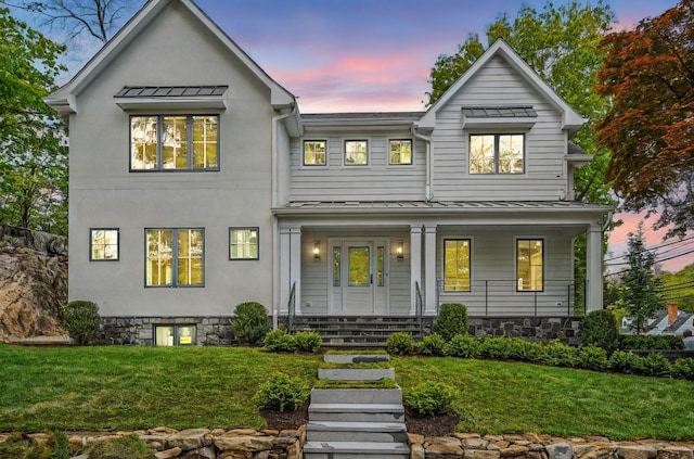 2 Lavender Ln, Rye, NY 10580 - modern farmhouse with a standing seam roof, covered porch, and a yard